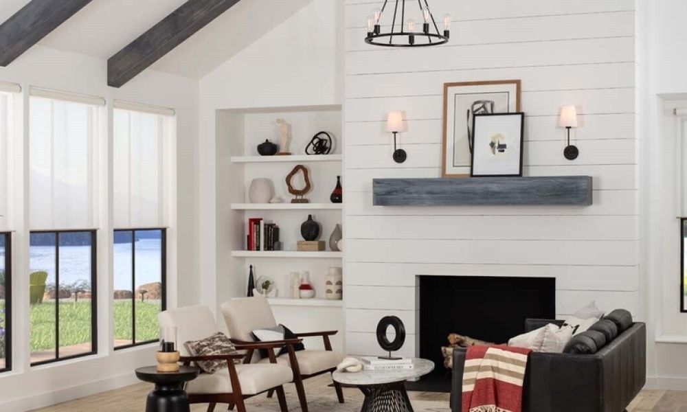 A home’s dining area with Hunter Douglas shades partially lowered over the windows.